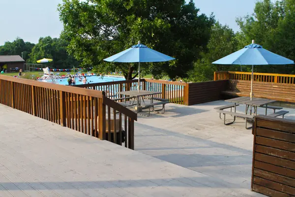 The large deck with umbrellas and picnic tables